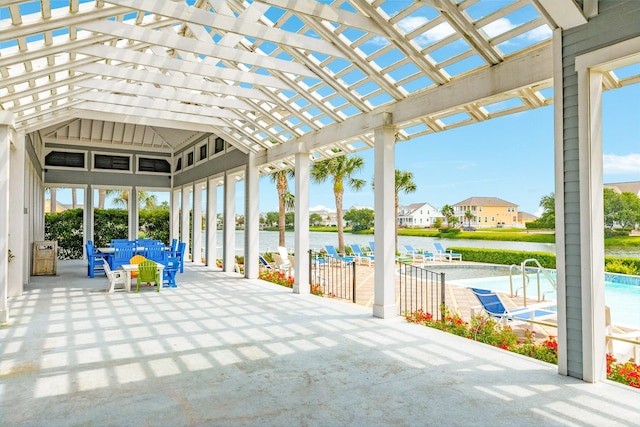 9 Caravelle Ct, Galveston, TX 77554 - unfurnished sunroom with a water view and vaulted ceiling
