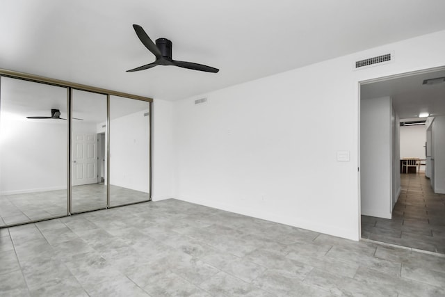 unfurnished bedroom featuring a closet and ceiling fan