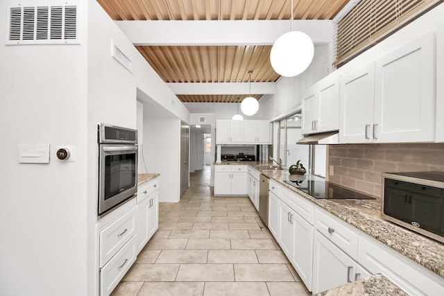 kitchen featuring stainless steel appliances, wood ceiling, beam ceiling, backsplash, and white cabinets
