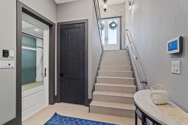 3835 Seabreeze Ln, Galveston, TX 77554 - staircase with a textured wall and carpet flooring