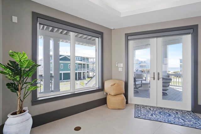 3835 Seabreeze Ln, Galveston, TX 77554 - doorway to outside with french doors and tile patterned floors