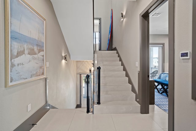 3835 Seabreeze Ln, Galveston, TX 77554 - stairway with tile patterned floors