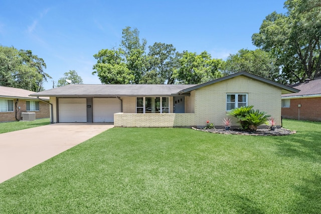 1201 Terrace Dr, Alvin, TX 77511 - ranch-style house featuring a garage, brick siding, central AC unit, driveway, and a front lawn