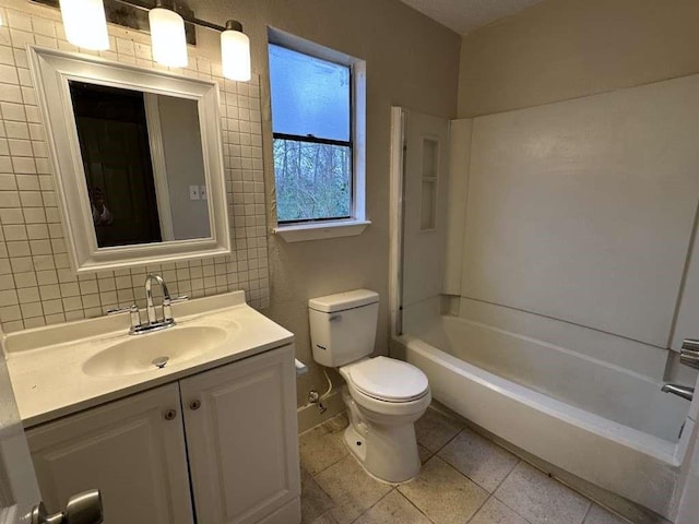 5919 Woodview Dr, Houston, TX 77396 - bathroom with toilet, vanity, tile patterned floors, backsplash, and tub / shower combination