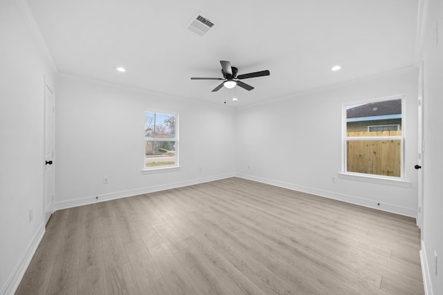spare room featuring ornamental molding, a ceiling fan, light wood finished floors, recessed lighting, and baseboards