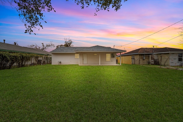 view of back of house at dusk
