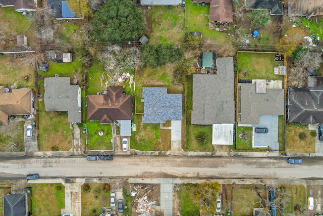 aerial view of property and surrounding area featuring nearby suburban area
