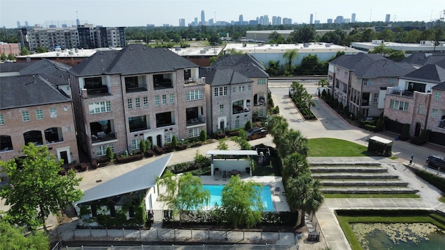 6003 Matthew Oaks Pl, Houston, TX 77007 - drone / aerial view of city skyline and a pool area