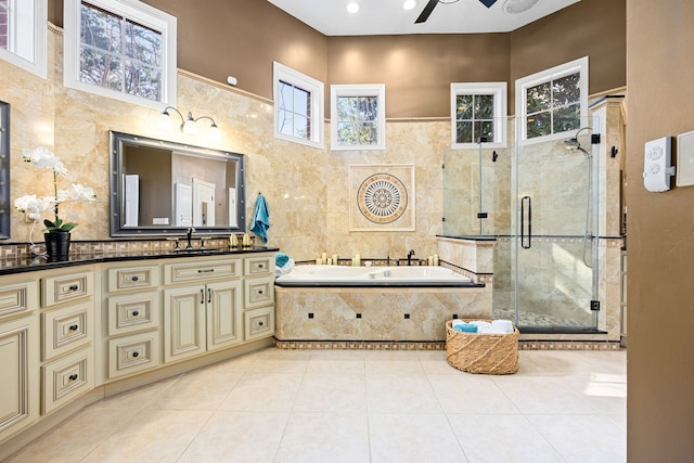 17511 Hawkin Ln, Tomball, TX 77377 - bathroom featuring a shower stall, a garden tub, ceiling fan, vanity, and tile patterned floors