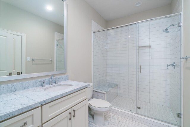 817 Blackshire Ln, Houston, TX 77055 - full bathroom featuring a shower stall, toilet, tile patterned flooring, vanity, and recessed lighting