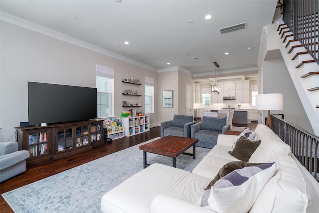 817 Blackshire Ln, Houston, TX 77055 - living room with dark wood finished floors, healthy amount of natural light, stairway, recessed lighting, and crown molding