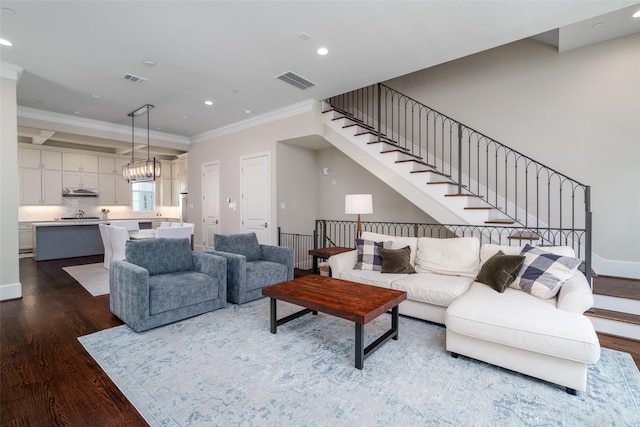 817 Blackshire Ln, Houston, TX 77055 - living area featuring ornamental molding, dark wood-style floors, recessed lighting, baseboards, and stairs
