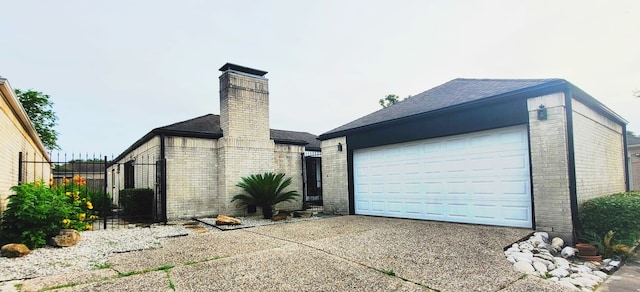 7515 Hopewell Ln, Houston, TX 77071 - view of front of house with brick siding, a chimney, a garage, and concrete driveway
