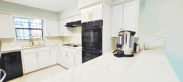7515 Hopewell Ln, Houston, TX 77071 - kitchen featuring a sink, under cabinet range hood, black appliances, white cabinetry, and light stone countertops