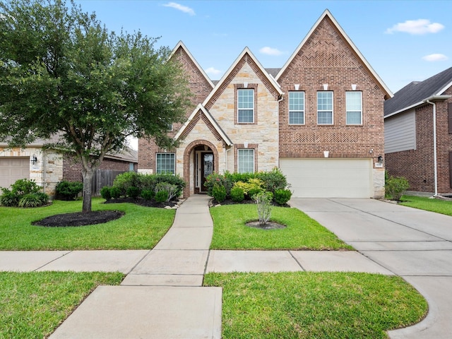 18118 Berry Garden Ln, Spring, TX 77379 - view of front facade with an attached garage, stone siding, concrete driveway, and brick siding