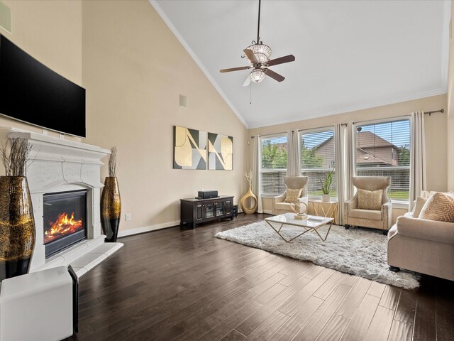 18118 Berry Garden Ln, Spring, TX 77379 - living area with ornamental molding, high vaulted ceiling, ceiling fan, a glass covered fireplace, and wood finished floors