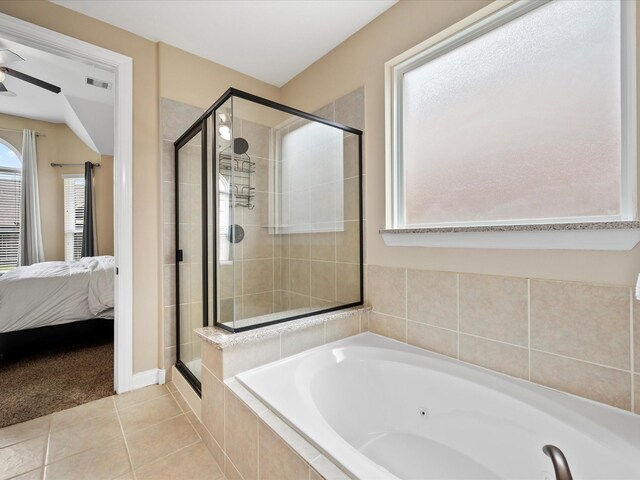18118 Berry Garden Ln, Spring, TX 77379 - ensuite bathroom featuring a stall shower, a tub with jets, tile patterned floors, and a ceiling fan