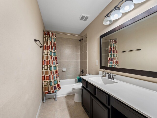 18118 Berry Garden Ln, Spring, TX 77379 - full bathroom with tile patterned flooring, vanity, shower / bath combo with shower curtain, toilet, and baseboards