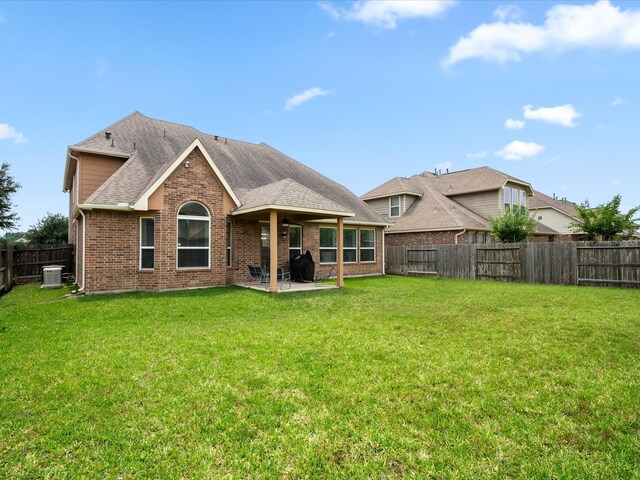 18118 Berry Garden Ln, Spring, TX 77379 - back of house featuring a patio, brick siding, roof with shingles, cooling unit, and ceiling fan