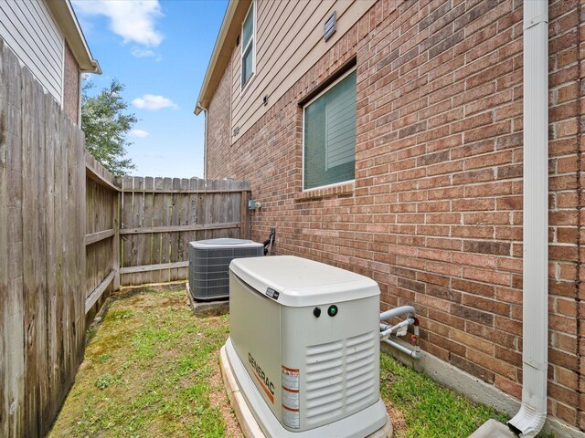 18118 Berry Garden Ln, Spring, TX 77379 - exterior view of a power unit, central AC, and brick siding