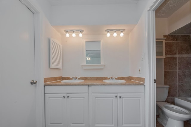 10306 Jillana Kaye Dr, Houston, TX 77086 - full bathroom featuring double vanity, toilet, a tub to relax in, and a shower
