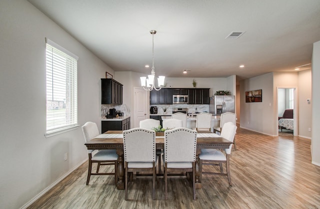 6002 Purple Iris St, Katy, TX 77449 - dining area featuring a chandelier, light wood-type flooring, baseboards, and recessed lighting