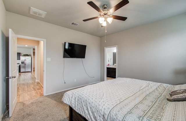 6002 Purple Iris St, Katy, TX 77449 - bedroom featuring stainless steel fridge, carpet, baseboards, and a ceiling fan