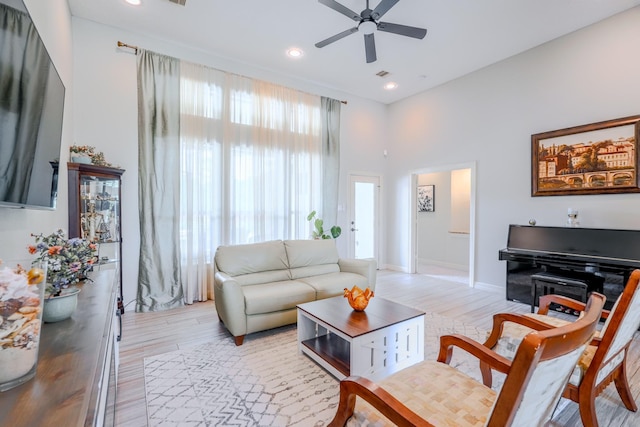 3907 Movado Ct, Spring, TX 77386 - living room featuring light wood-style floors, ceiling fan, recessed lighting, and baseboards
