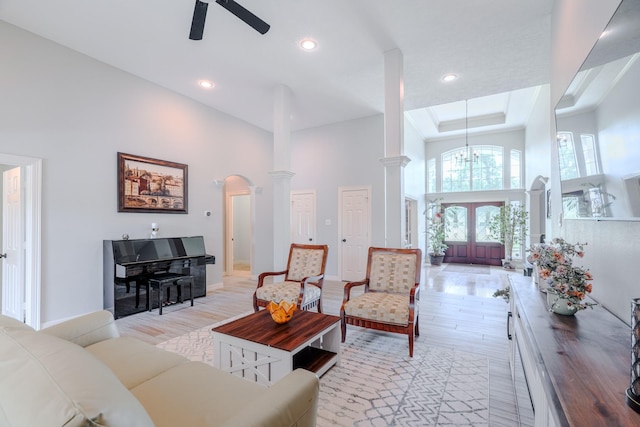 3907 Movado Ct, Spring, TX 77386 - living area featuring ornate columns, a high ceiling, light wood finished floors, ceiling fan, and recessed lighting