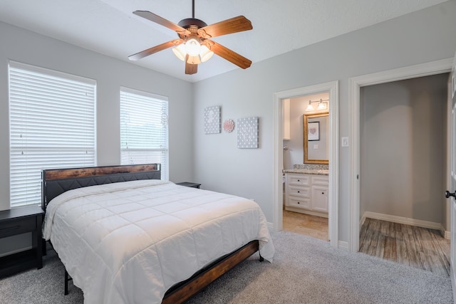 3907 Movado Ct, Spring, TX 77386 - bedroom featuring light colored carpet, baseboards, connected bathroom, and a ceiling fan