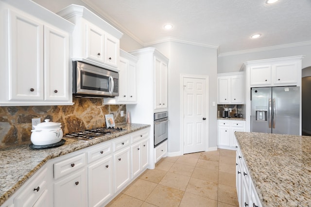 3907 Movado Ct, Spring, TX 77386 - kitchen featuring appliances with stainless steel finishes, white cabinets, backsplash, light tile patterned floors, and light stone counters