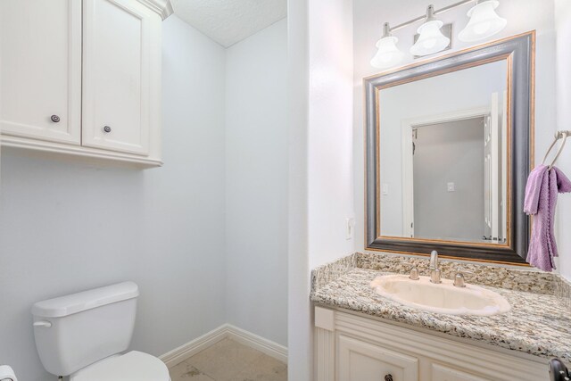 3907 Movado Ct, Spring, TX 77386 - bathroom featuring toilet, baseboards, and vanity