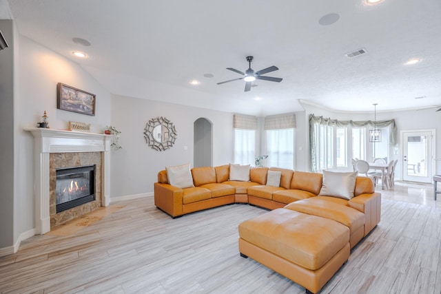 3907 Movado Ct, Spring, TX 77386 - living room featuring ceiling fan, light wood-style floors, baseboards, a fireplace, and recessed lighting