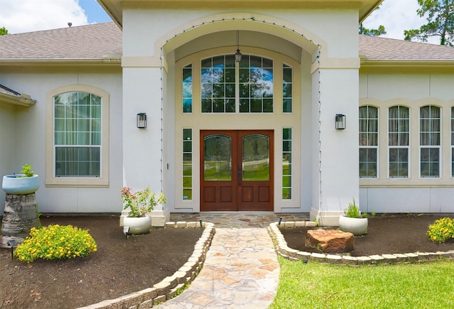 3907 Movado Ct, Spring, TX 77386 - view of exterior entry with a shingled roof and stucco siding