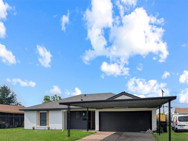 10938 Fleming Dr, Houston, TX 77013 - ranch-style home with brick siding, driveway, an attached garage, and a shingled roof