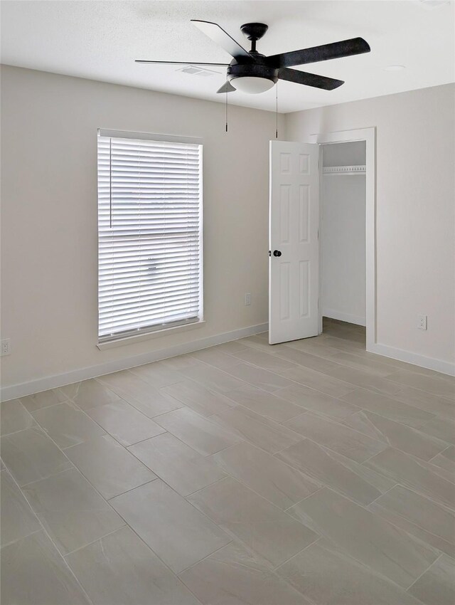 10938 Fleming Dr, Houston, TX 77013 - unfurnished bedroom with baseboards, ceiling fan, and a closet