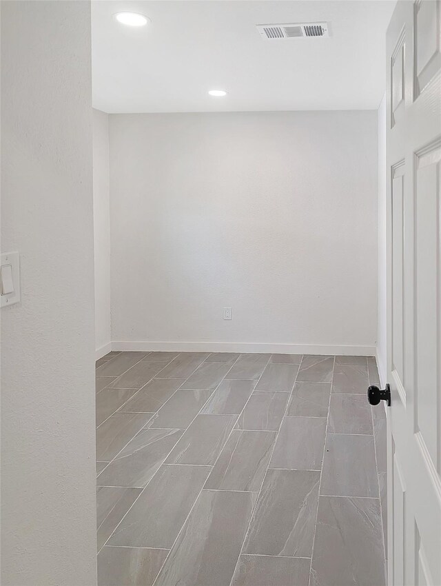 10938 Fleming Dr, Houston, TX 77013 - spare room featuring baseboards and recessed lighting