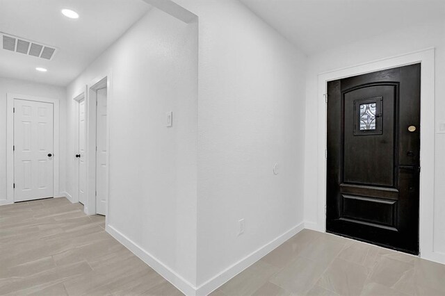 10938 Fleming Dr, Houston, TX 77013 - entrance foyer with baseboards and recessed lighting