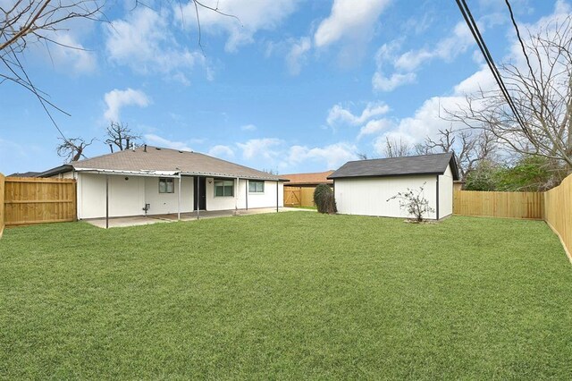 10938 Fleming Dr, Houston, TX 77013 - back of property featuring a patio area and an outbuilding
