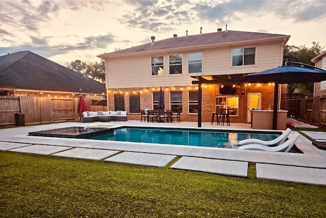 20815 Winlock Trace Dr, Katy, TX 77450 - view of swimming pool featuring an outdoor living space, a fenced backyard, a patio area, and an in-ground hot tub