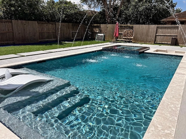 20815 Winlock Trace Dr, Katy, TX 77450 - view of pool with an in-ground hot tub and a fenced backyard