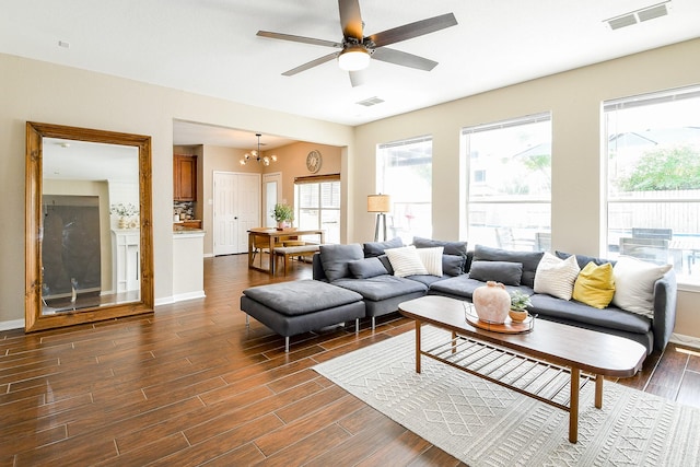 20815 Winlock Trace Dr, Katy, TX 77450 - living room with healthy amount of natural light, dark wood-style floors, a chandelier, and ceiling fan