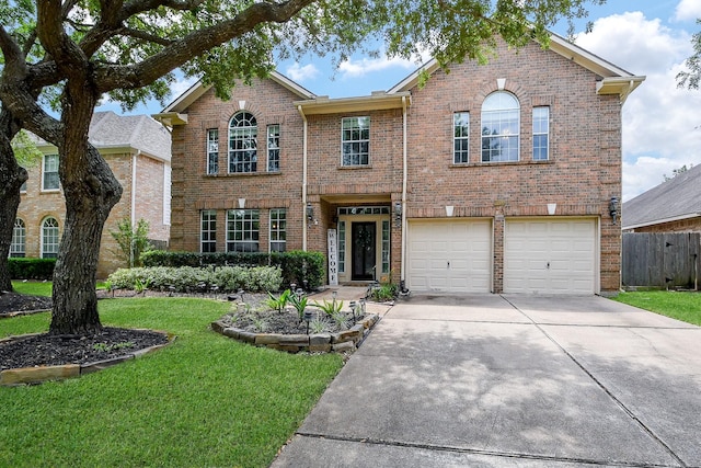 20815 Winlock Trace Dr, Katy, TX 77450 - traditional-style home featuring brick siding, concrete driveway, and a garage