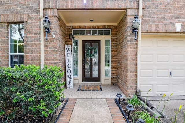 20815 Winlock Trace Dr, Katy, TX 77450 - view of exterior entry with brick siding and a garage