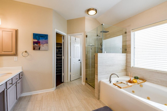 20815 Winlock Trace Dr, Katy, TX 77450 - bathroom with a stall shower, a tub with jets, vanity, and a walk in closet