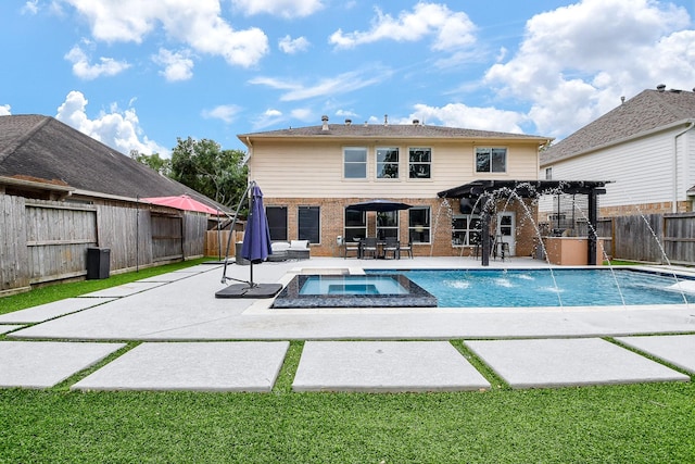 20815 Winlock Trace Dr, Katy, TX 77450 - view of swimming pool featuring a pergola, a patio area, a fenced backyard, and a pool with connected hot tub