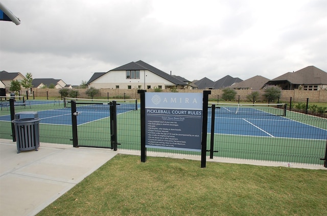 19015 Giara Pony Trl, Tomball, TX 77377 - view of tennis court featuring a residential view