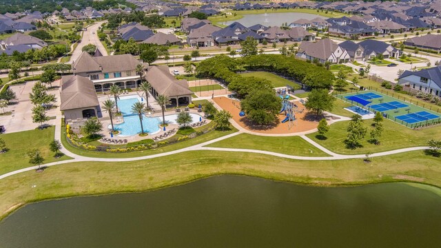 19015 Giara Pony Trl, Tomball, TX 77377 - aerial view of residential area with a pool area and a large body of water