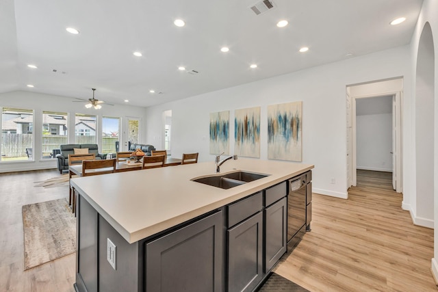 19015 Giara Pony Trl, Tomball, TX 77377 - kitchen featuring dishwasher, light countertops, a kitchen island with sink, light wood-type flooring, and recessed lighting