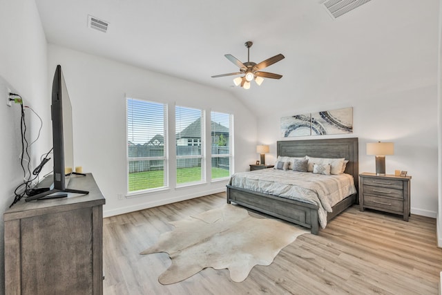 19015 Giara Pony Trl, Tomball, TX 77377 - bedroom featuring light wood-type flooring, lofted ceiling, and ceiling fan